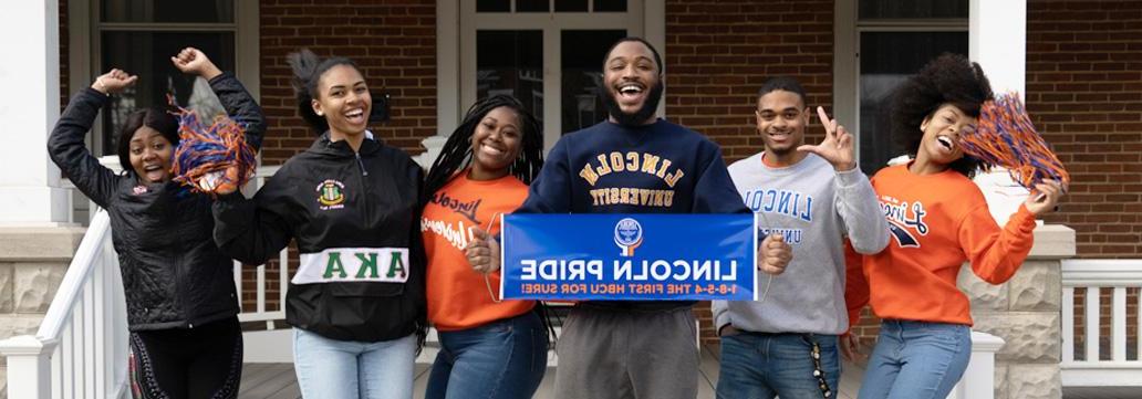 Group of students holding Lincoln Pride Banner