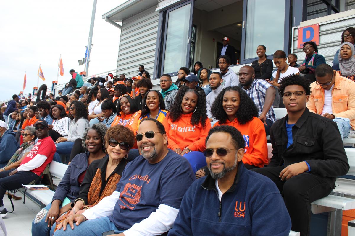 Group of alumni on bleachers